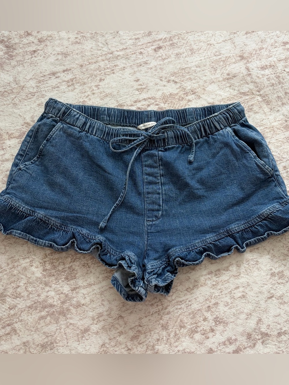 American Eagle denim shorts with ruffled hem and drawstring